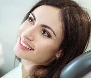 Image of a Young lady sitting on the dentist chair